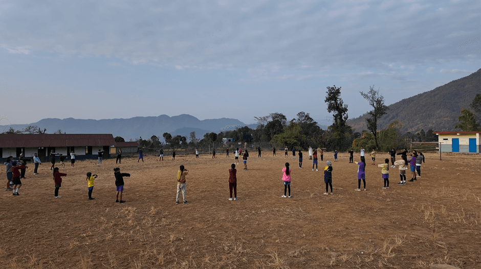 Children warm up before the running session.